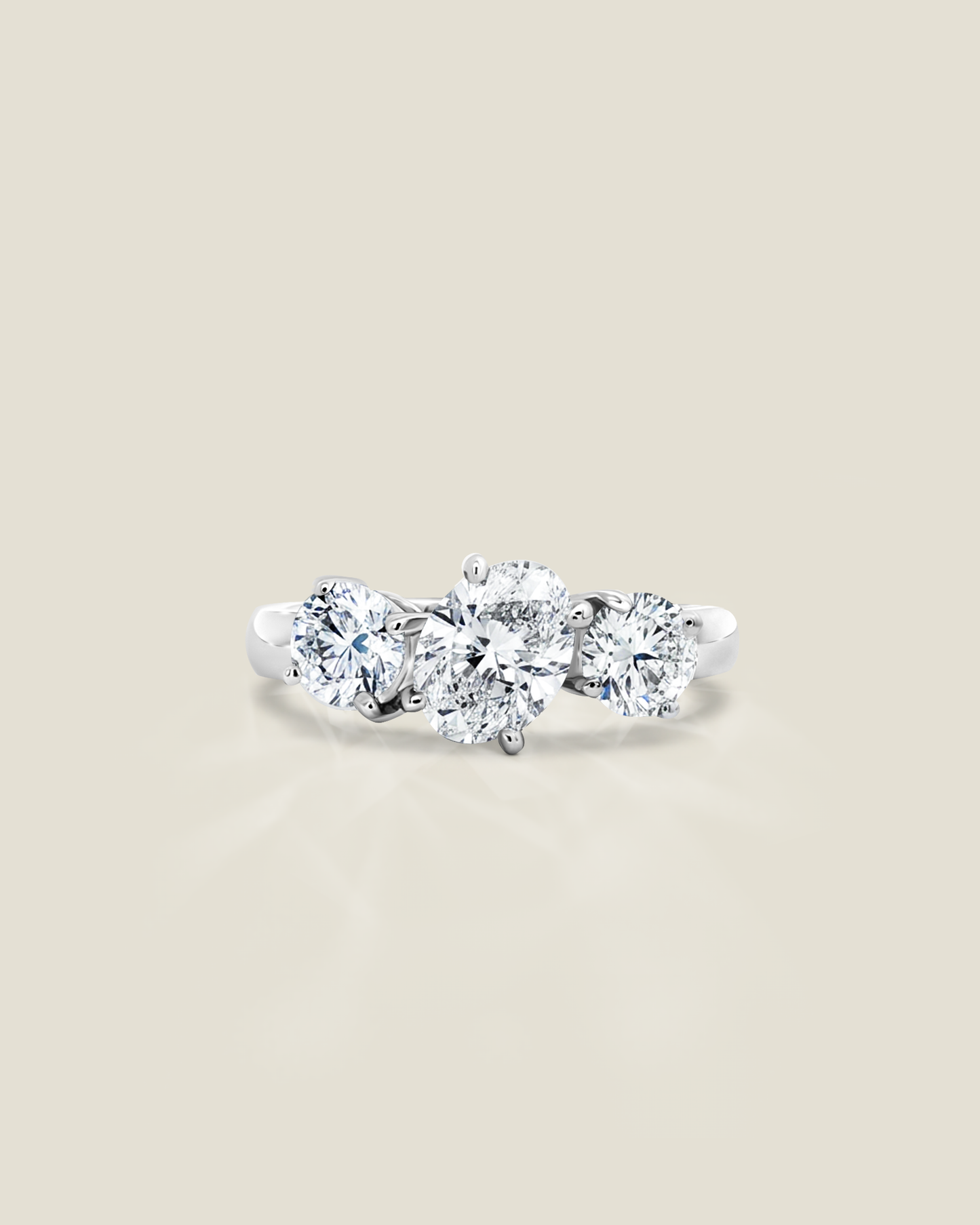 18K White Gold 1.82 ctw Oval & Round Three Stone Ring